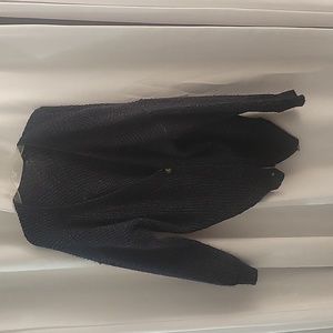 Dark sweater with brown buttons